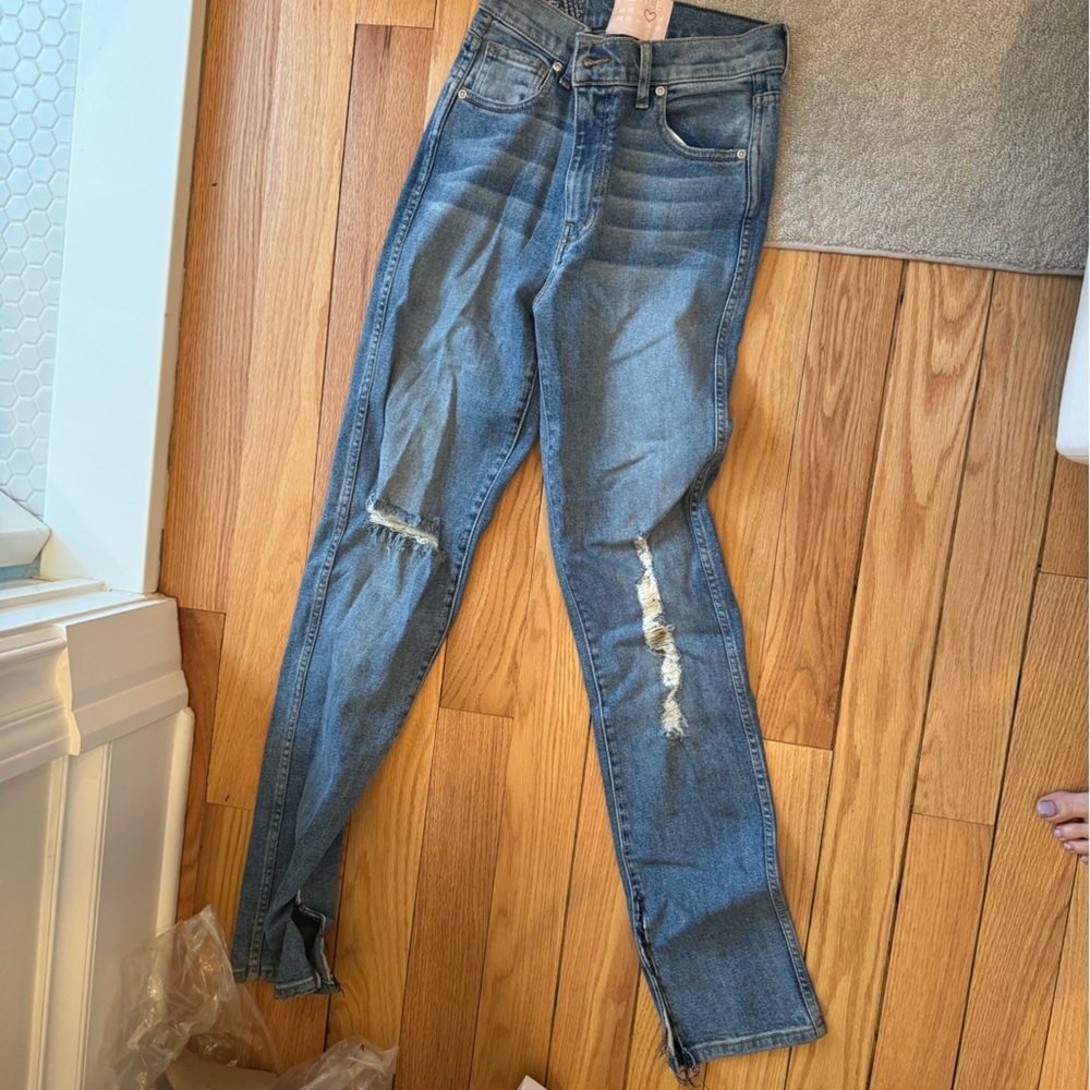 Revice denim with rips and a butt rip in back high waisted